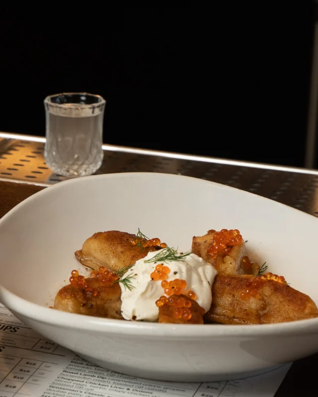 A match made in heaven. 🥔🍸
Potato Vareniki with lemon brown butter & smoked trout roe, alongside a shot of horseradish-infused frozen vodka.
Some things simply belong together.